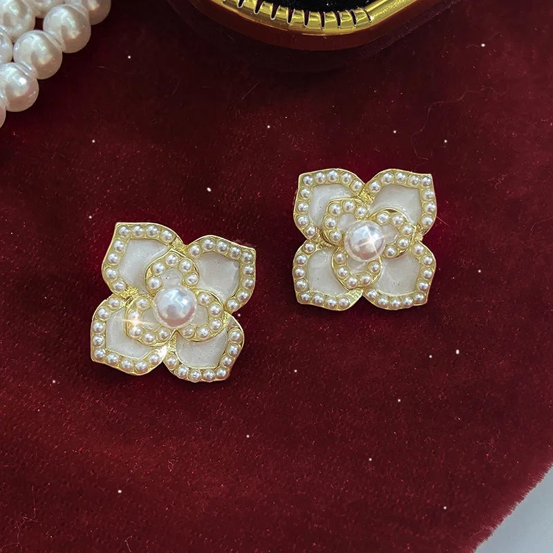 Korean-inspired geometric pearl ear clips with contrast colors. Retro style, no ear piercing required.