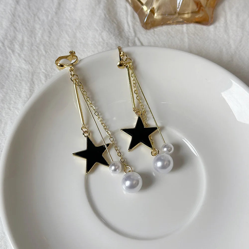 Korean-inspired geometric pearl ear clips with contrast colors. Retro style, no ear piercing required.