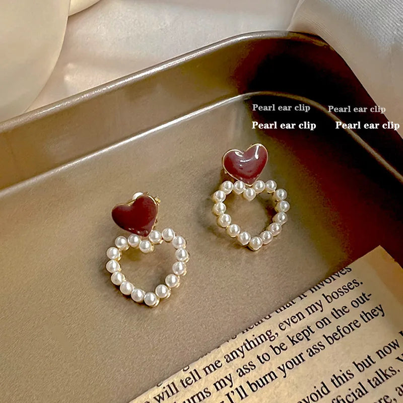 Korean-inspired geometric pearl ear clips with contrast colors. Retro style, no ear piercing required.