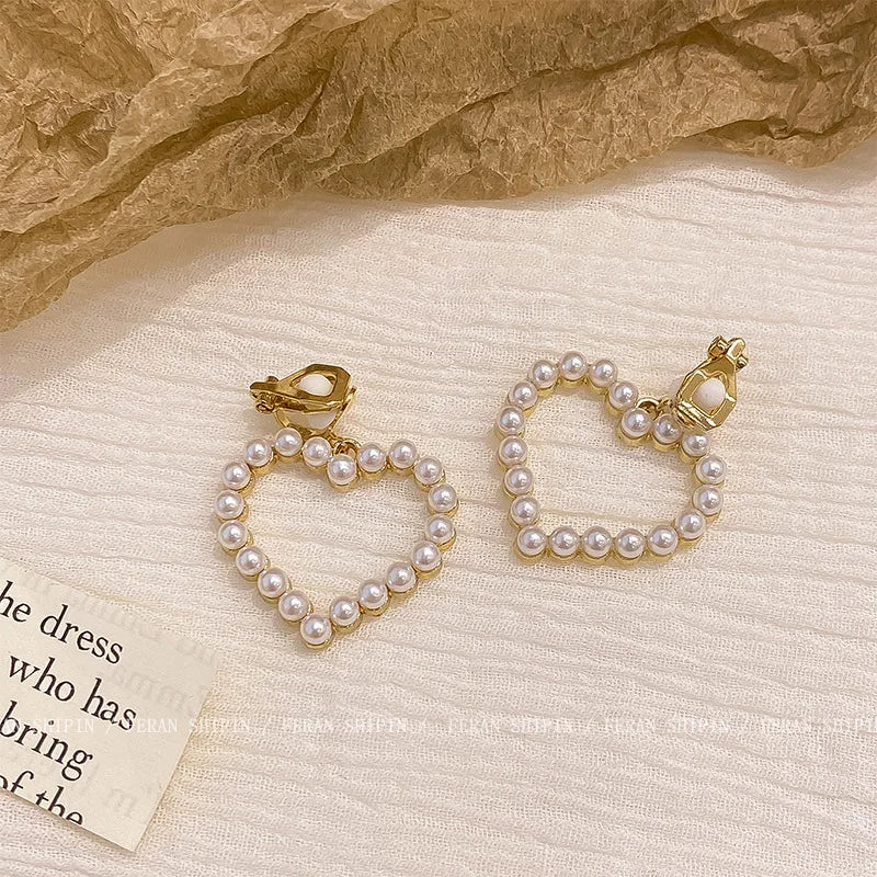 Korean-inspired geometric pearl ear clips with contrast colors. Retro style, no ear piercing required.