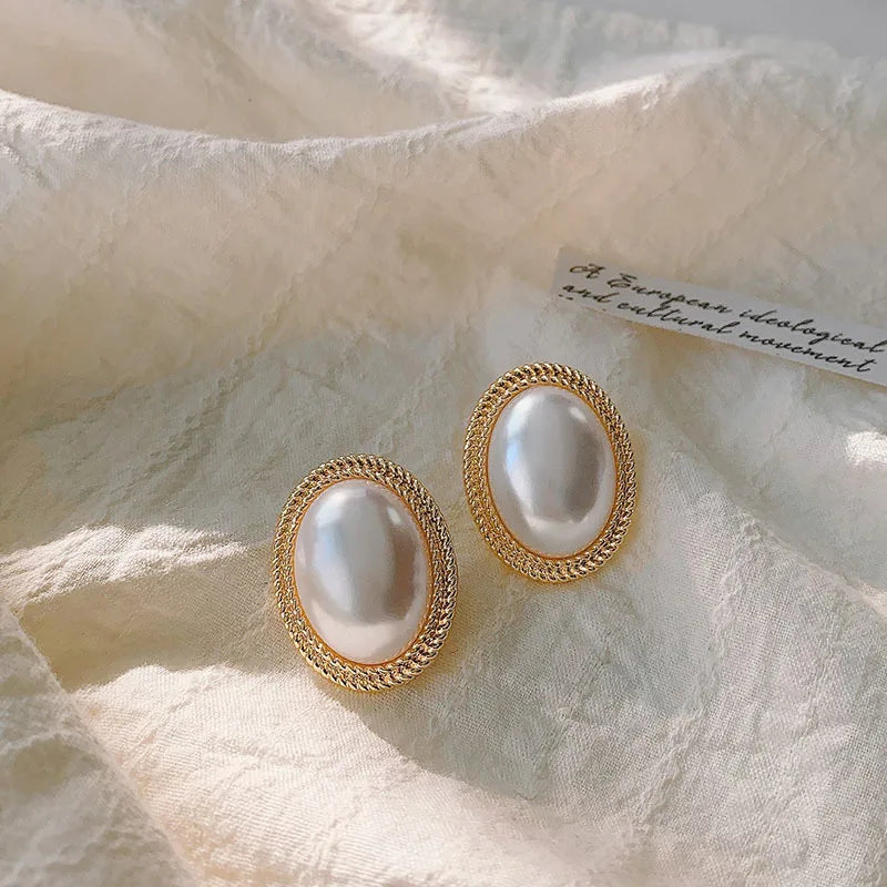 Korean-inspired geometric pearl ear clips with contrast colors. Retro style, no ear piercing required.